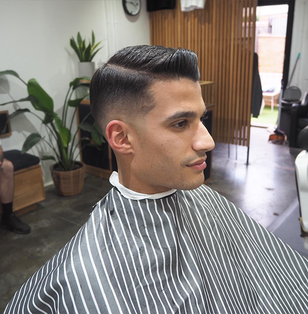 side photo of a mens fade haircut